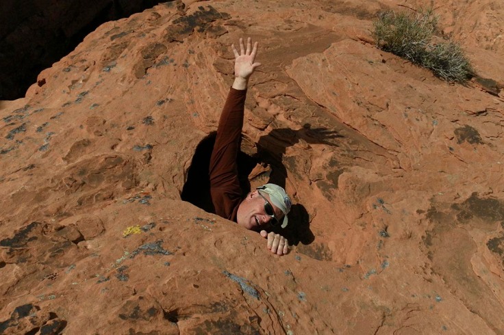 Hiker swallowed up by sandstone manhole, Valley of Fire State Park, Nevada by Steve Bruno